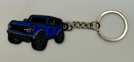 Keychain with Antimatter blue vehicle design on a white background